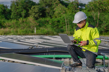 Asian engineer working at Floating solar power plant,Renewable energy,Technician and investor solar panels checking the panels at solar energy installation