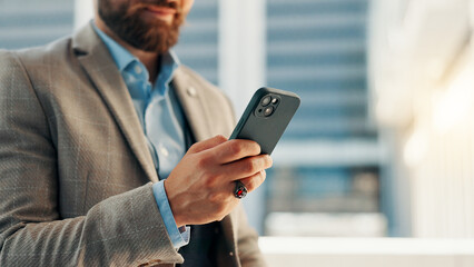 City, phone and hands of business man for networking, social media and website for contact. professional, corporate and person on smartphone for text message, email and online in town for travel.