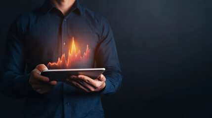 Financial Growth at Hand: A professional holds a tablet with a glowing upward trend, showcasing the power of data in driving financial success.