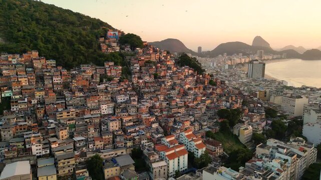 Aerial View of Cantagalo Slum and Copacabana District Below on Sunrise in Rio de Janeiro, Brazil