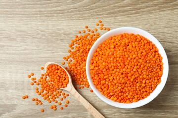 Red lentils on a wooden background