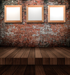 Empty photo frames on the brick wall