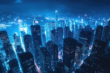 Obraz premium Illuminated Urban Nightscape: Blue-Hued View of Downtown Skyscrapers in New York City