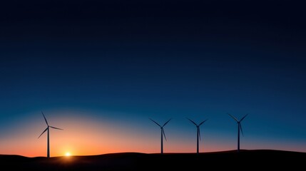 Four wind turbines stand tall in a rural setting as the sun sets on the horizon, casting warm hues across the sky, highlighting the tranquility of the evening