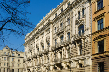 Fototapeta premium Old historic Art Nouveau building in Riga Elizabetes 33, Latvia, featuring intricate stucco decorations, decorative balconies and neoclassical columns.