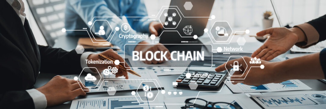 Professionals engaging in a strategic business meeting discussing blockchain technology impact on finance and digital transactions, showcasing innovation and collaboration. Amity - Powered by Adobe