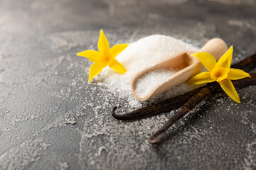 Aromatic vanilla sugar. Vanilla pods. Vanilla sticks, brown and white sugar in a bowl on a textured...