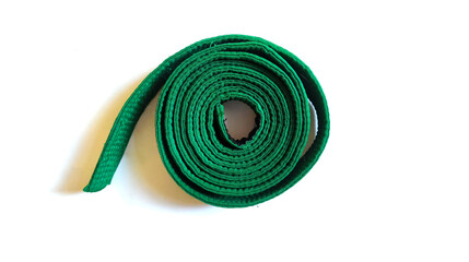 Green martial arts belt isolated on white background. Background for diplomas, posters, martial...