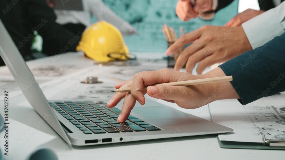 Poster a dynamic workspace scene showing hands actively engaging in planning and design work using a laptop