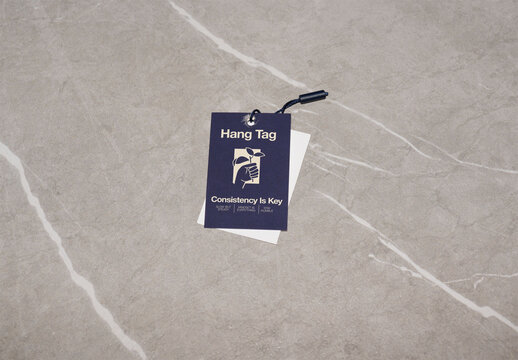 Mockup of a Hang Tag Design on a Textured Surface