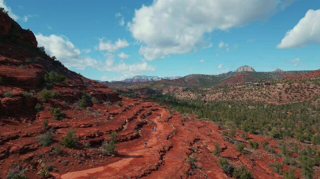 Hikers walking on Templeton Trail at Cathedral Rock in Sedona Arizona