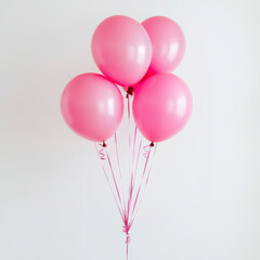 Bright pink latex balloons arranged for a joyful event or party theme. Girl baby shower balloon decor isolated on a white background