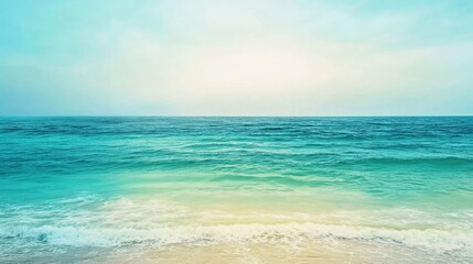 Obraz premium Serene Tropical Ocean Gradient with Aqua Blue Sea, Green Tones, and Gentle Waves Breaking on a Sandy Shoreline