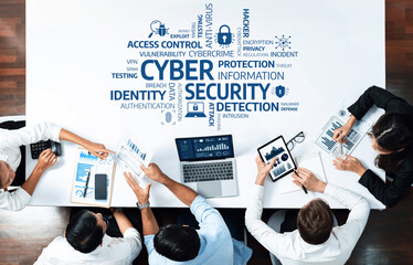Teams collaborate in a modern office setting, focusing on strategies for enhancing cybersecurity,...