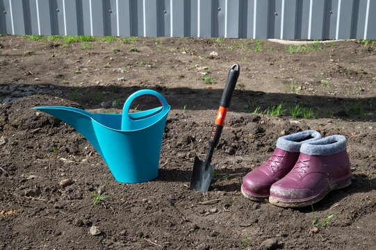 Rubber boots, watering can and shovel - Garden tools for gardening