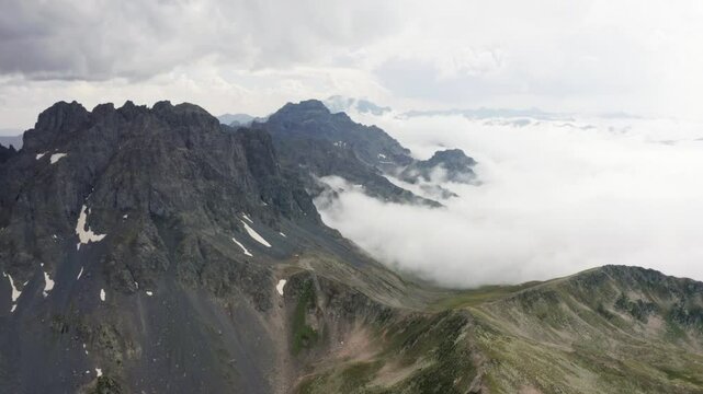 It shows one of the peaks of the Ka&ccedil;kar Mountains in Rize among the clouds. It reflects its natural and geological richness with its hard rock structure, snow slopes and impressive valley view.
