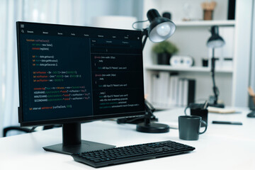 Programming code on computer screen desktop placing on working desk showing intelligent website...