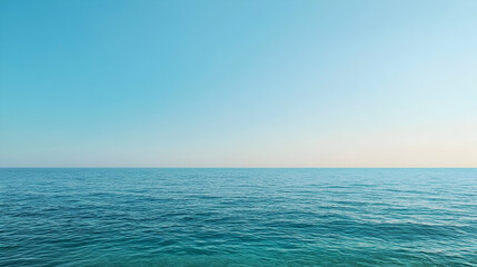 Obraz premium Calm Ocean Horizon Under Clear Blue Sky
