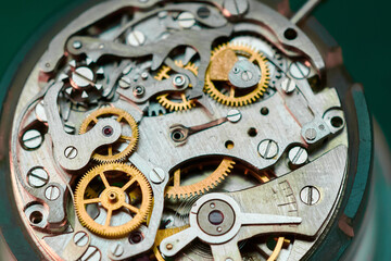 Intricate dance of gears and springs captured in a mesmerizing macro view of a wristwatch mechanism