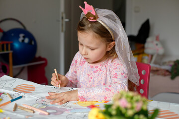 girl drawing in her room. child development. kindergarten
