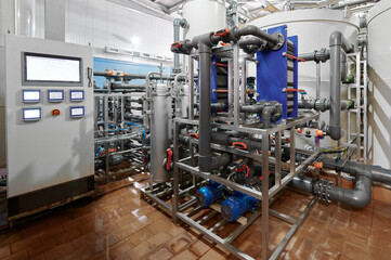 Detailed view of chemical plant pipelines and valves highlighting industrial processes in a working facility