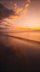 Fototapeta premium A warm sunset over a minimalist ocean soft orange