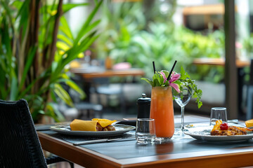 Casual dining setting with brunch dishes and a refreshing drink for a relaxed life
