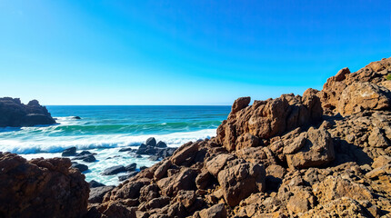 Waves and rocks in sea shore. Beautiful scenic nature view.