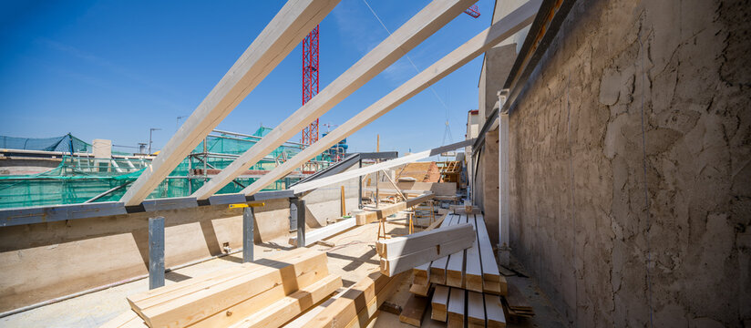 Construction Site with Exposed Beams and Building Materials