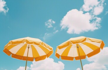 A cheerful summer scene featuring iconic yellow umbrellas invites joy.