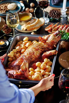 Festive dining table with a roasted suckling pig and diverse sides
