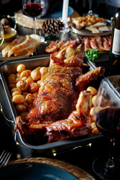 Gourmet roasted suckling pig on festive dinner table