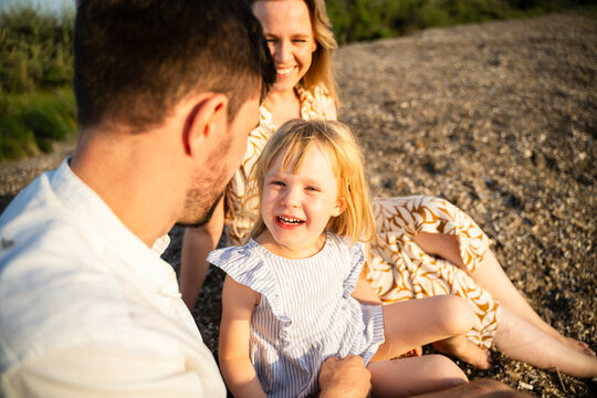 Family Enjoying a Sunny Day on the Italian Beach