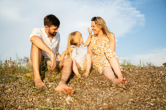 Family Enjoying a Relaxing Day at the Beach in Italy