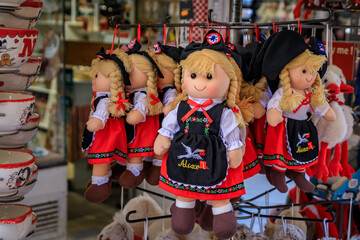 Obraz premium Alsatian dolls in traditional folk outfits on display at a store, Colmar, France