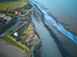 aerial view of Happisburgh, Norfolk, UK, a coastline threatened by rising sea level and coastal...