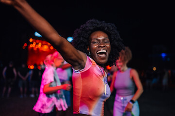 Joyful celebration at a nighttime music festival