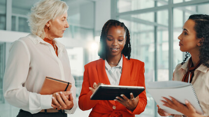 Agenda, meeting and tablet with business women in lobby of office for planning or strategy. Collaboration, feedback and schedule with employee team at work for discussion, negotiation or review