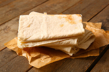 Fresh lavash on wooden background
