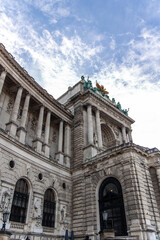 Fototapeta premium Neue Burg Wing of Hofburg Palace rising majestically against cloudy sky in Vienna