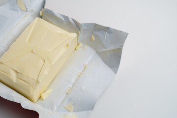Farm fresh butter close up on light background. Butter tablet