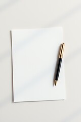 Luxurious Festive Letterhead with Elegant Black and Gold Pen in a Minimalist Sunlit Setting for Invitations and Branding