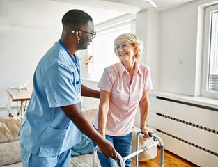 nurse doctor senior care caregiver help walker assistence retirement home nursing elderly woman black african american hospital clinic home disability disabled man