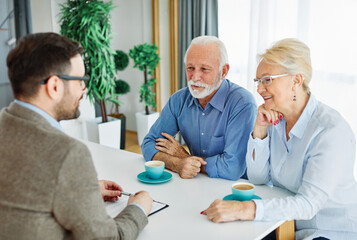 meeting agreement investment couple contract advice retirement consultation house finance senior elderly insurance senior couple office