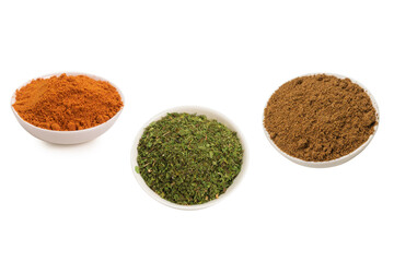 Mix spices in a bowl isolated on white.