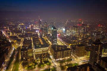 Obraz premium Night aerial drone view of Milan’s Porta Nuova and Porta Garibaldi