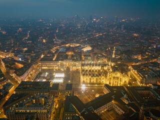 Obraz premium Night aerial drone view of illuminated Milano Duomo, Italy, lights