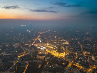 Obraz premium Night aerial drone view of illuminated Milano Duomo, Italy, lights
