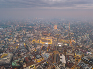 Night aerial drone view of illuminated Milano Duomo, Italy, lights