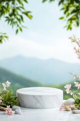 Elegant marble pedestal amidst blossoms, pebbles, and a mountain vista for product display